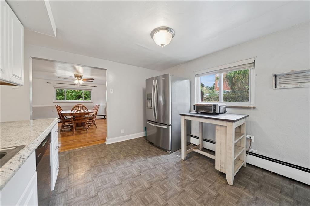 3454 Rigel Street Pittsburgh, PA 15212 - Photo 17 of 37 a kitchen with a stove and a refrigerator