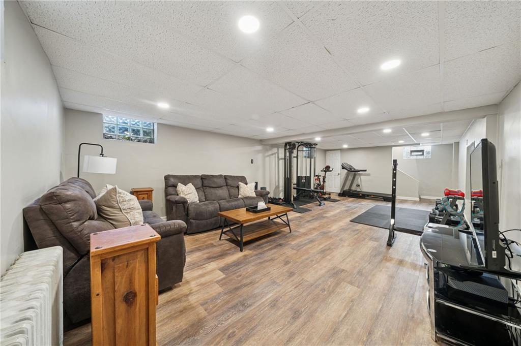 3454 Rigel Street Pittsburgh, PA 15212 - Photo 21 of 37 a living room with furniture and wooden floor