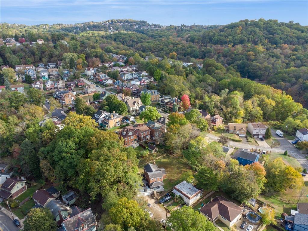 3454 Rigel Street Pittsburgh, PA 15212 - Photo 37 of 37 an aerial view of a houses with a lush green hillside