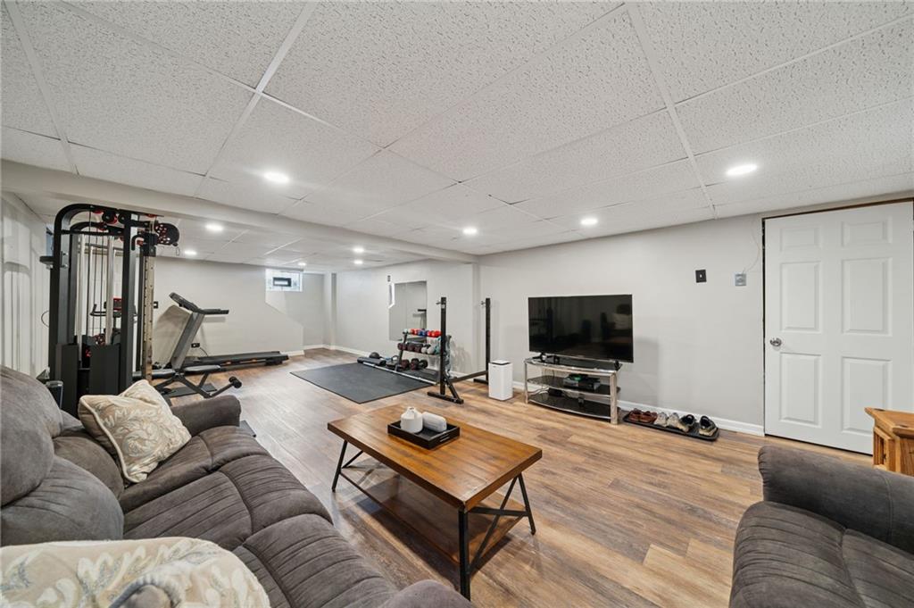 3454 Rigel Street Pittsburgh, PA 15212 - Photo 4 of 37 a living room with furniture and a flat screen tv