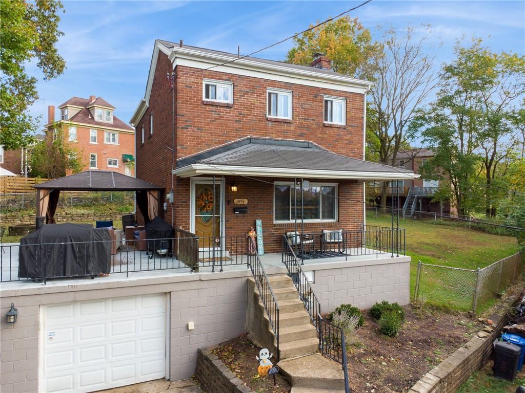 3454 Rigel Street Pittsburgh, PA 15212 - Photo 7 of 37 a front view of a house with swimming pool having outdoor seating