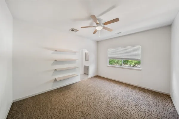 a view of an empty room with a window
