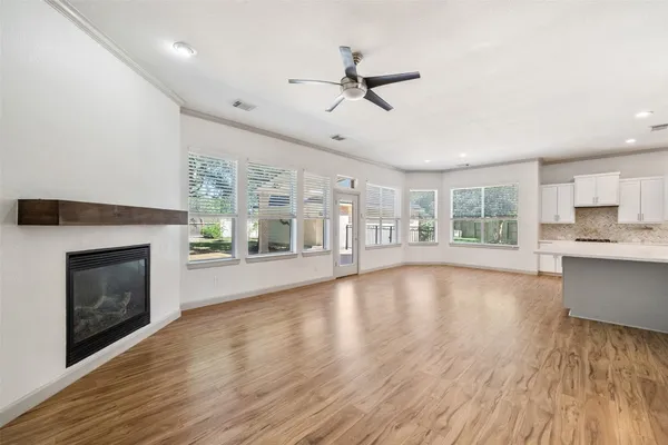a view of kitchen with cabinets and wooden floor