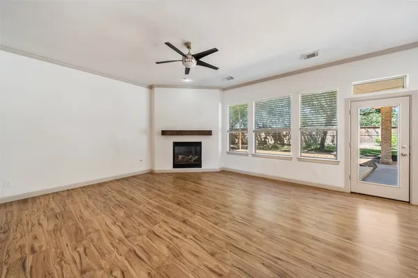 a living room with furniture potted plant and a large mirror
