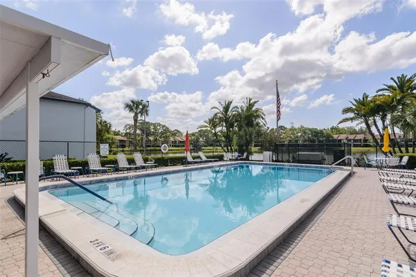a view of a swimming pool with a patio