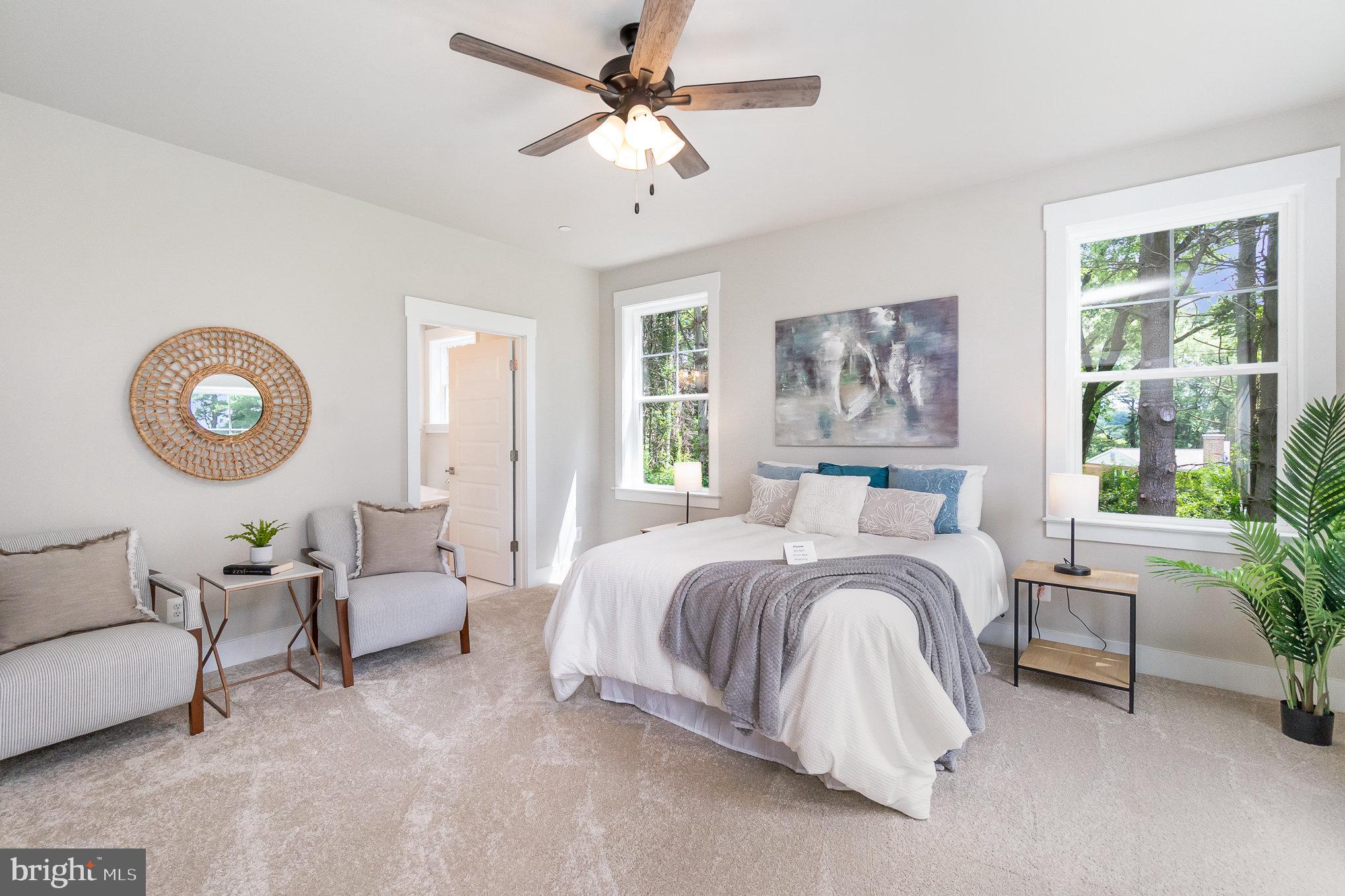 3104 Paper Mill Road Phoenix, MD 21131 - Photo 14 of 77 a spacious bedroom with a bed couch and a large window