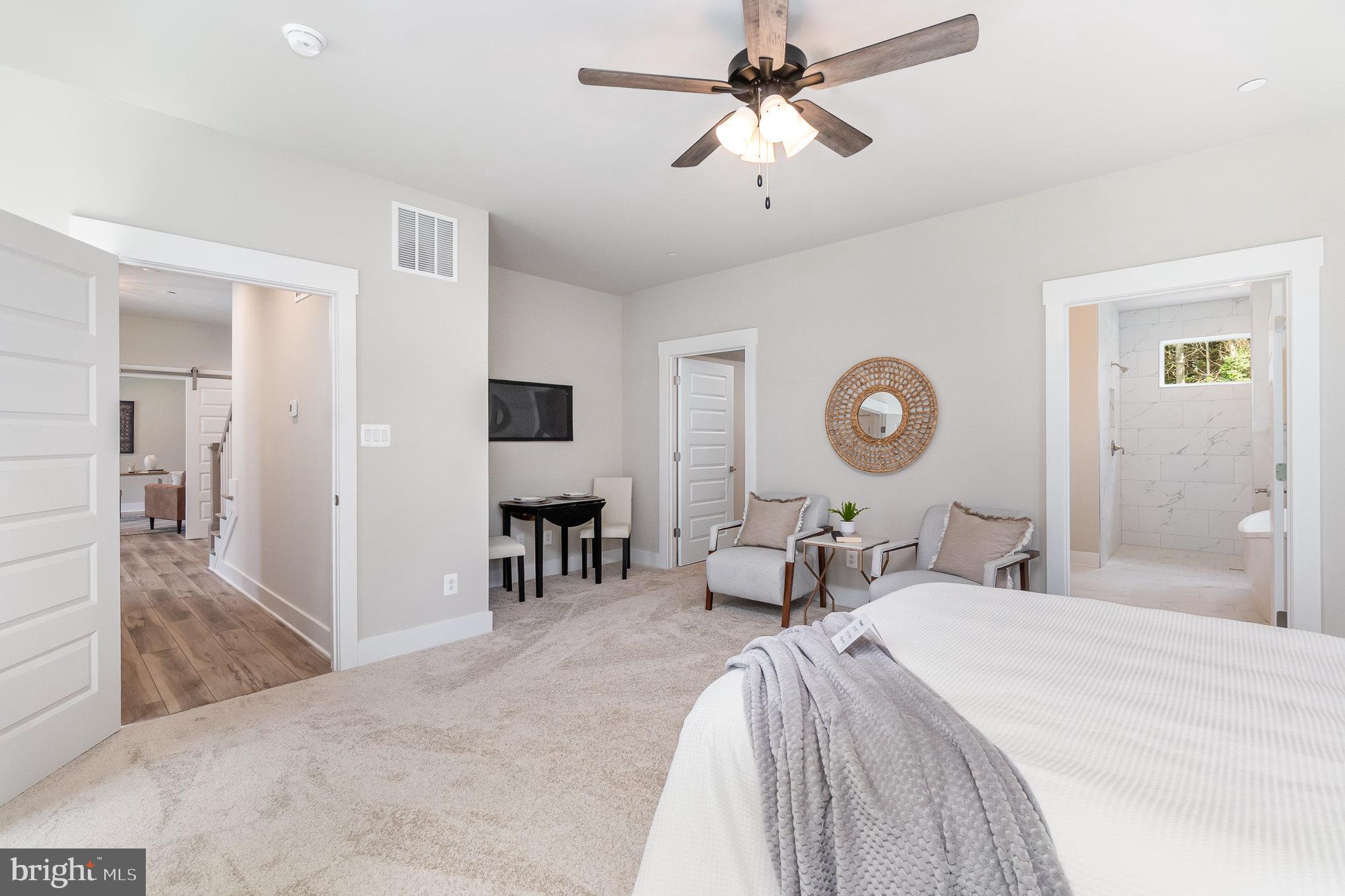 3104 Paper Mill Road Phoenix, MD 21131 - Photo 17 of 77 a bedroom with a bed and a chandelier