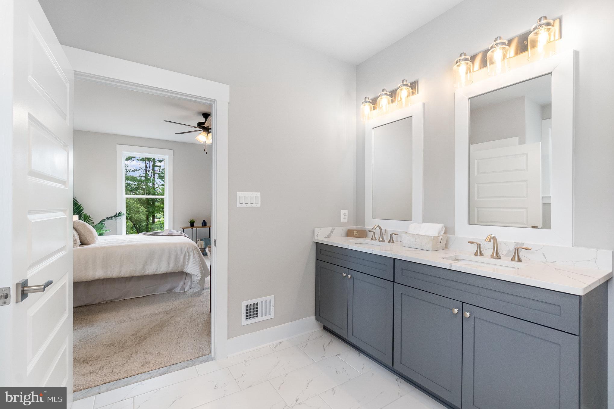 3104 Paper Mill Road Phoenix, MD 21131 - Photo 18 of 77 a en suite bathroom with double vanity and a mirror