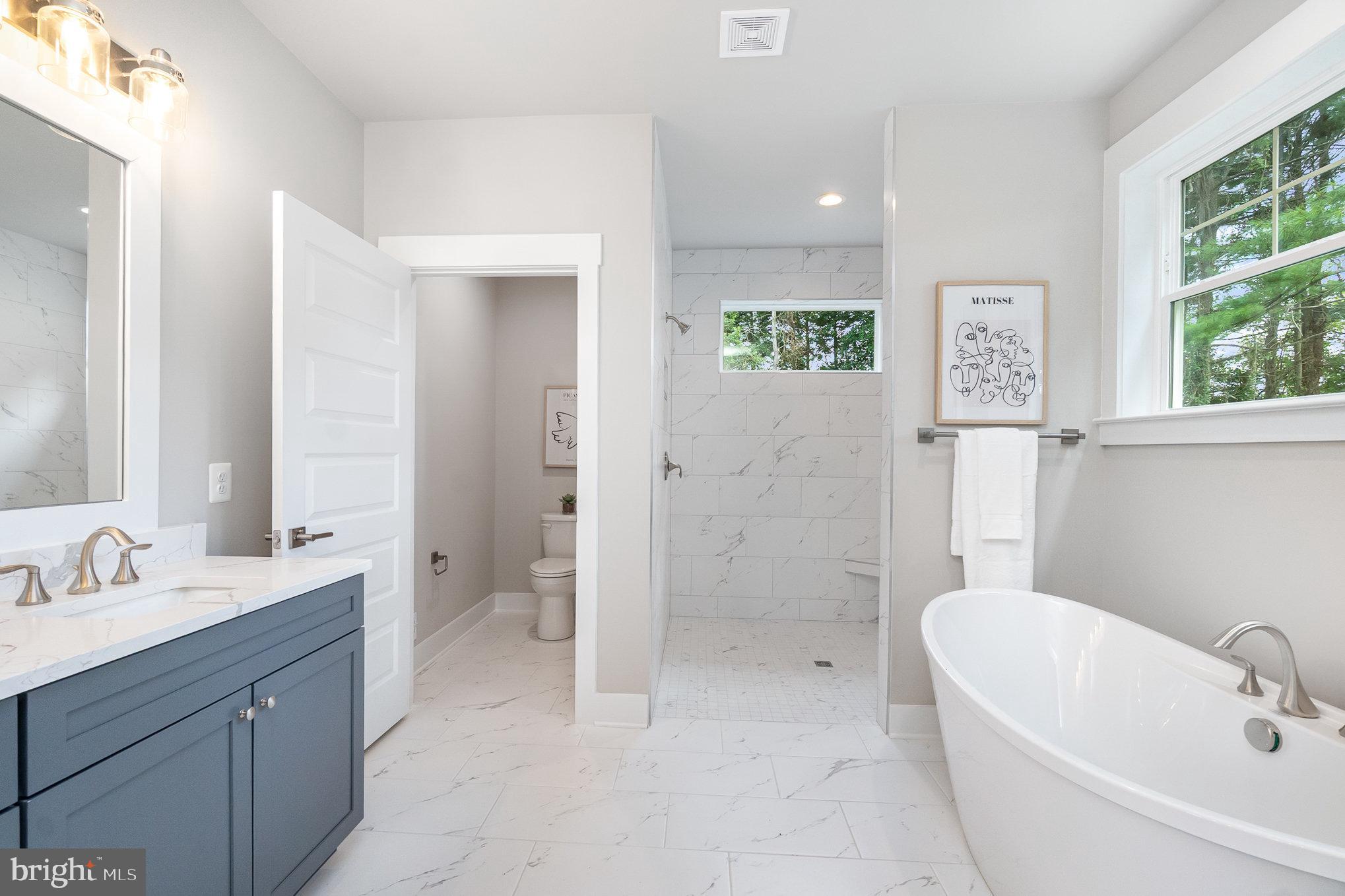 3104 Paper Mill Road Phoenix, MD 21131 - Photo 20 of 77 a bathroom with a sink a toilet and shower