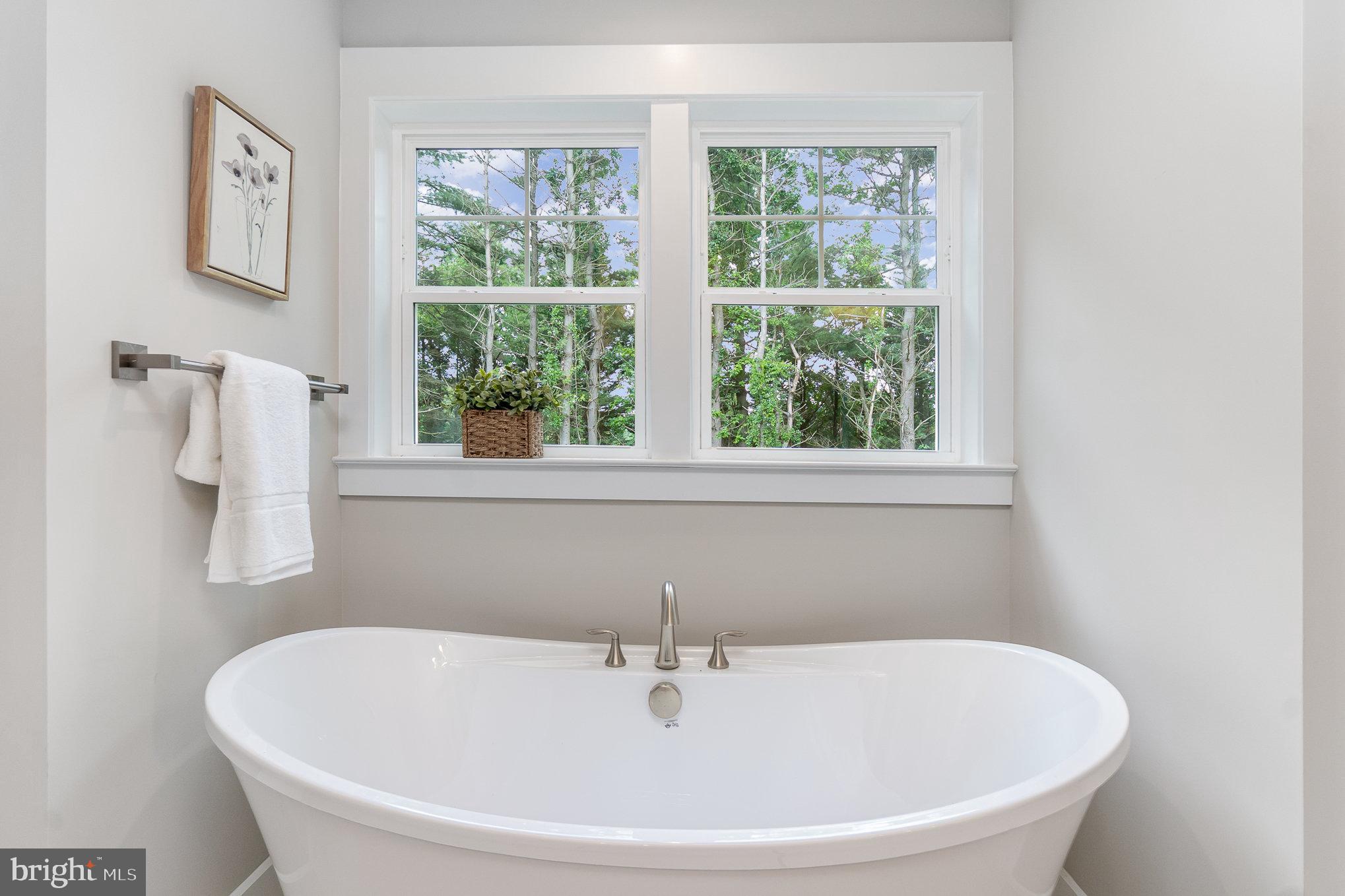 3104 Paper Mill Road Phoenix, MD 21131 - Photo 30 of 77 a white bath tub sitting next to a window