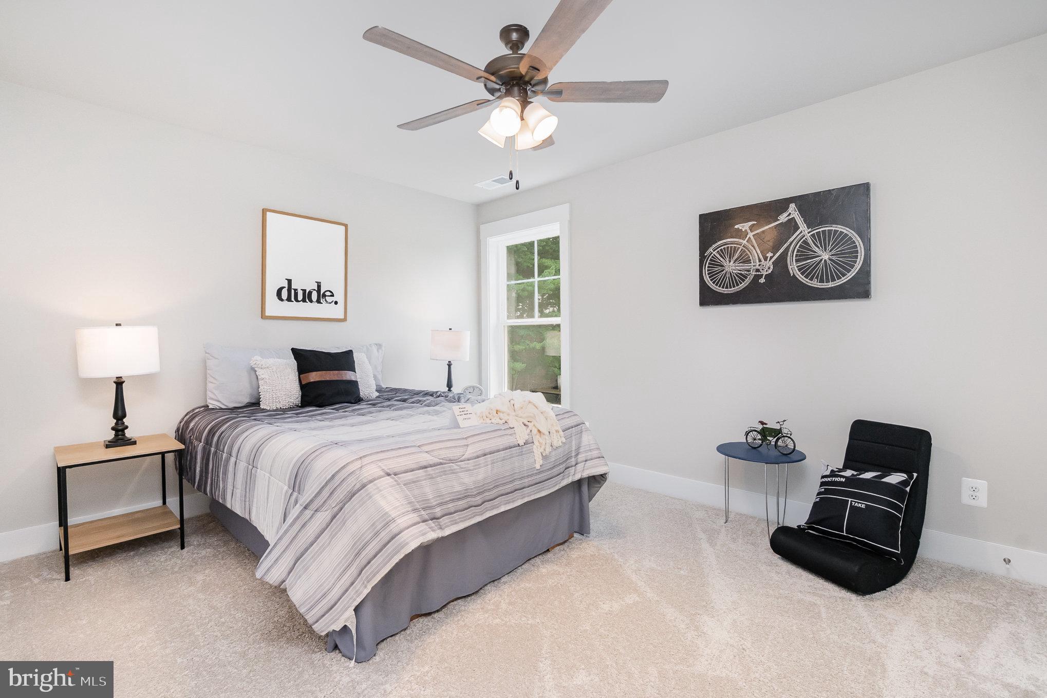 3104 Paper Mill Road Phoenix, MD 21131 - Photo 42 of 77 a bedroom with a bed and a chandelier