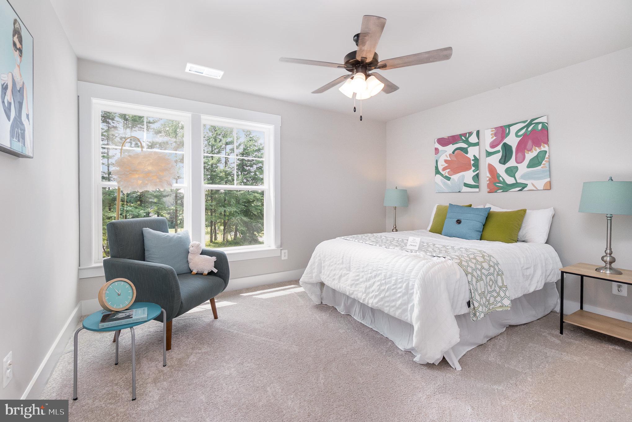 3104 Paper Mill Road Phoenix, MD 21131 - Photo 45 of 77 a spacious bedroom with a bed and a chandelier