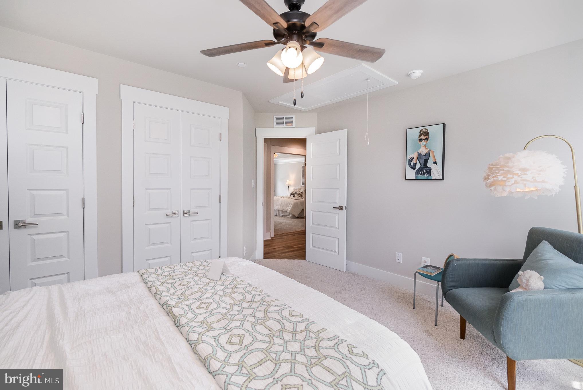 3104 Paper Mill Road Phoenix, MD 21131 - Photo 46 of 77 a bedroom with a bed and a chandelier