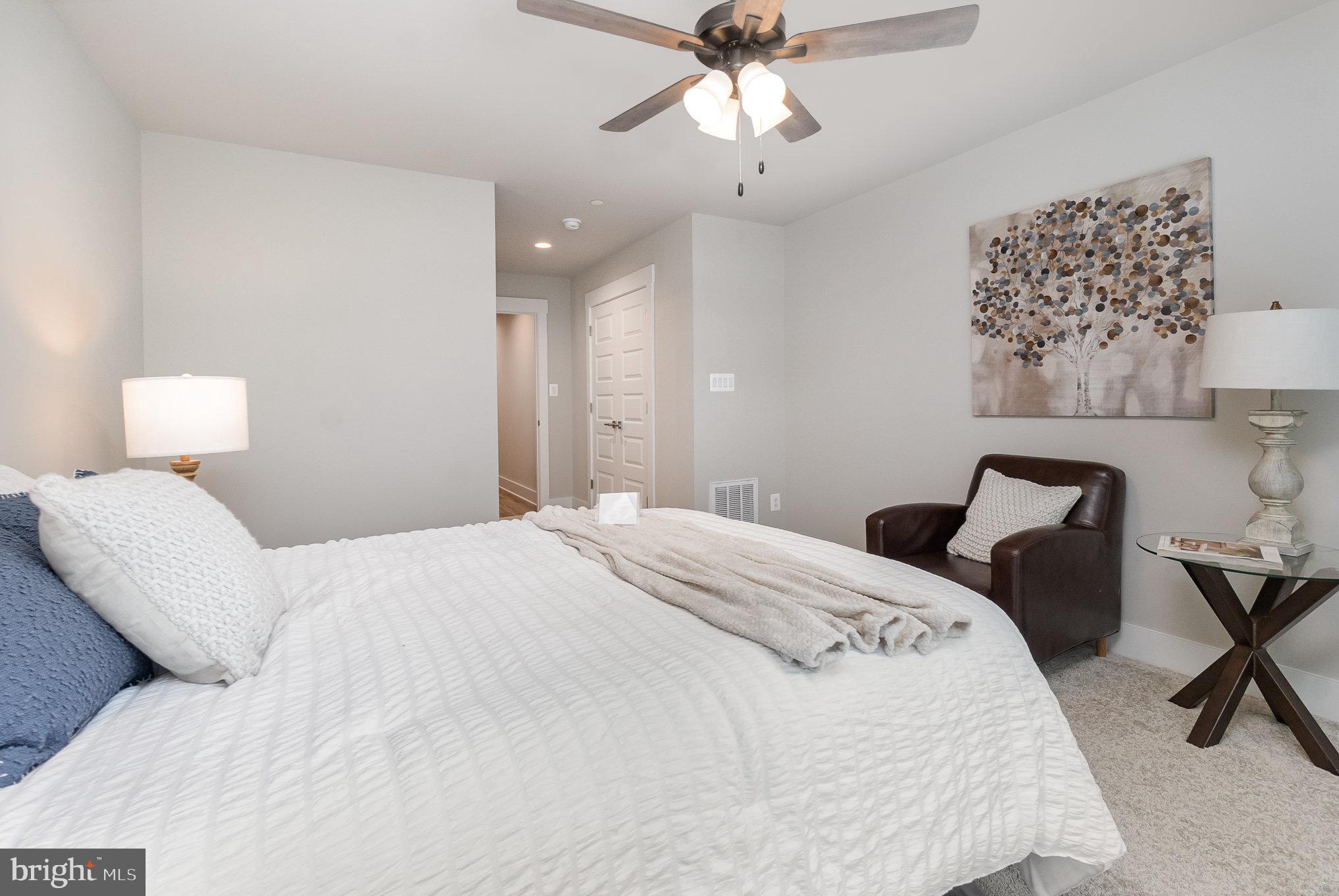 3104 Paper Mill Road Phoenix, MD 21131 - Photo 48 of 77 a bedroom with a bed and a chandelier