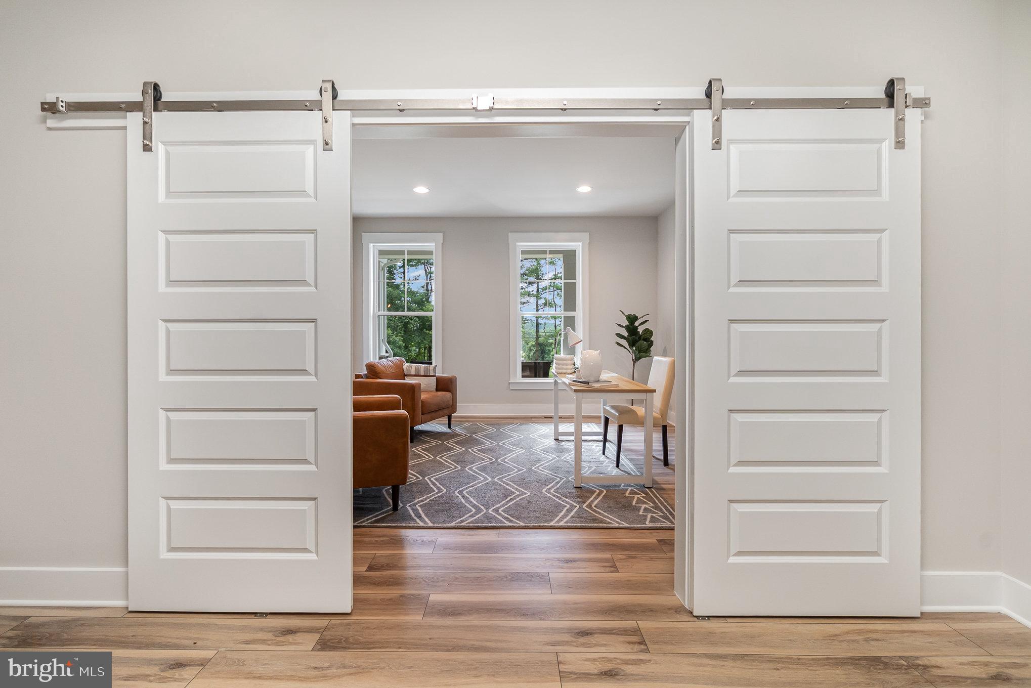 3104 Paper Mill Road Phoenix, MD 21131 - Photo 5 of 77 a view of a hallway and wooden floor dinning room and kitchen