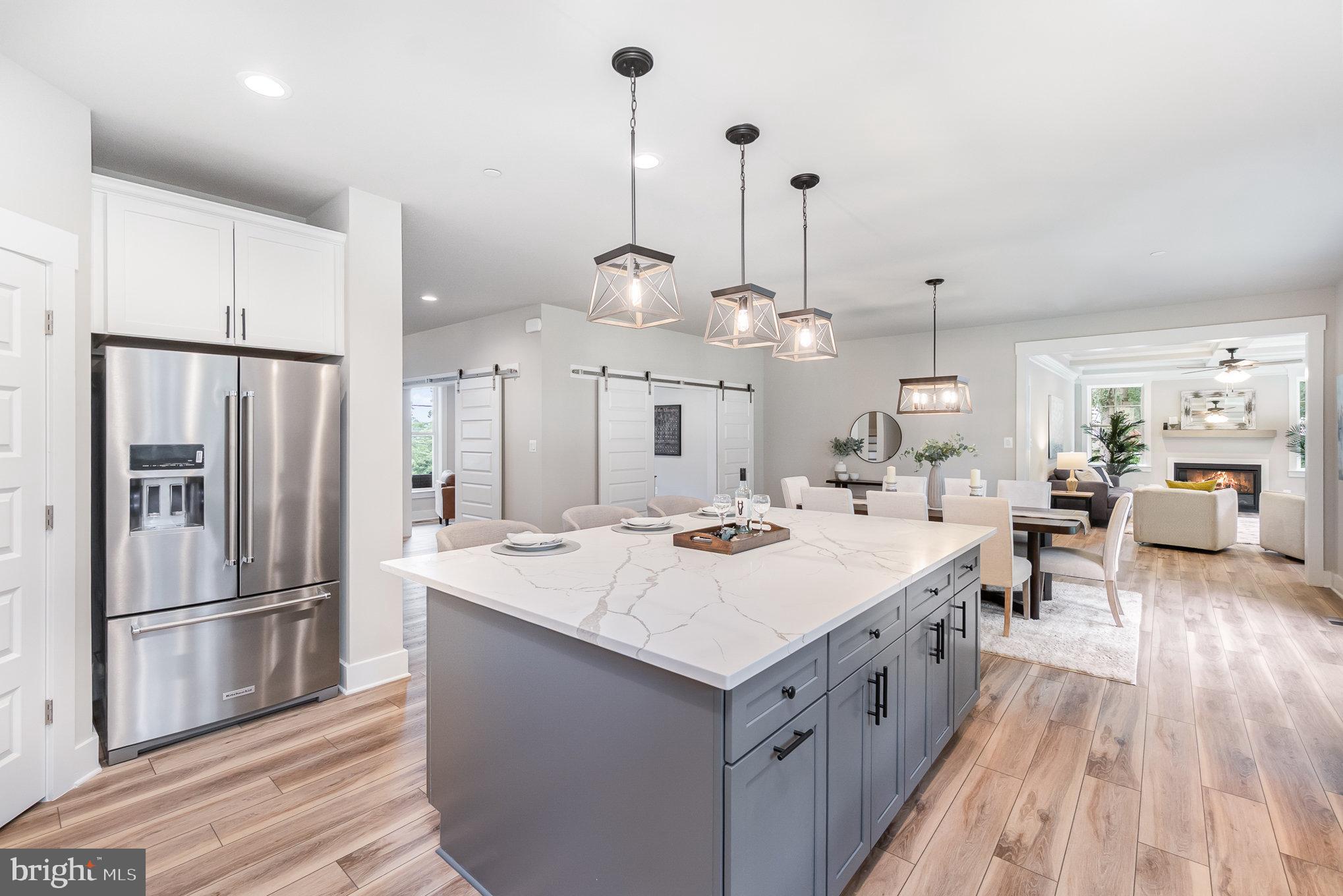 3104 Paper Mill Road Phoenix, MD 21131 - Photo 66 of 77 a large kitchen with stainless steel appliances kitchen island a large counter top a sink appliances and cabinets