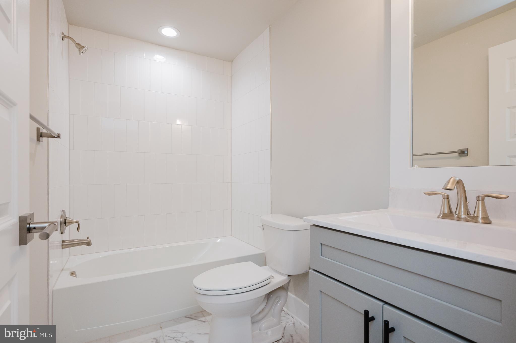 3104 Paper Mill Road Phoenix, MD 21131 - Photo 71 of 77 a bathroom with a sink a toilet and a bathtub