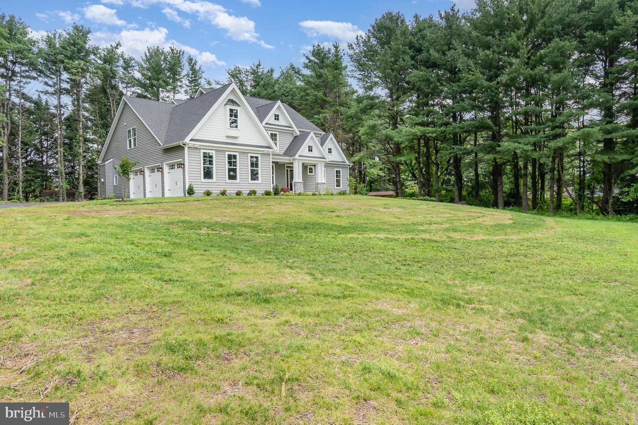 3104 Paper Mill Road Phoenix, MD 21131 - Photo 75 of 77 a front view of a house with a garden