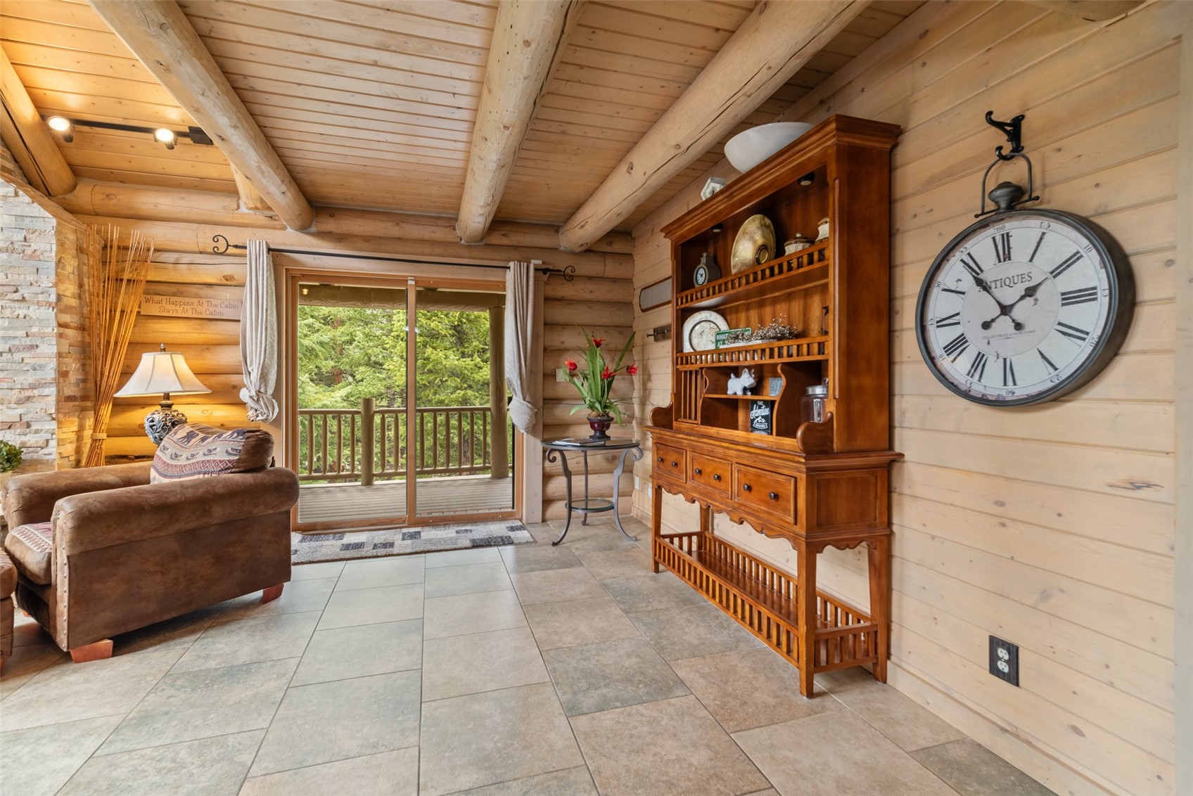 243 Rena Road Breckenridge, CO 80424 - Photo 31 of 50 Living area with beam ceiling, wood ceiling, log walls, and light tile floors
