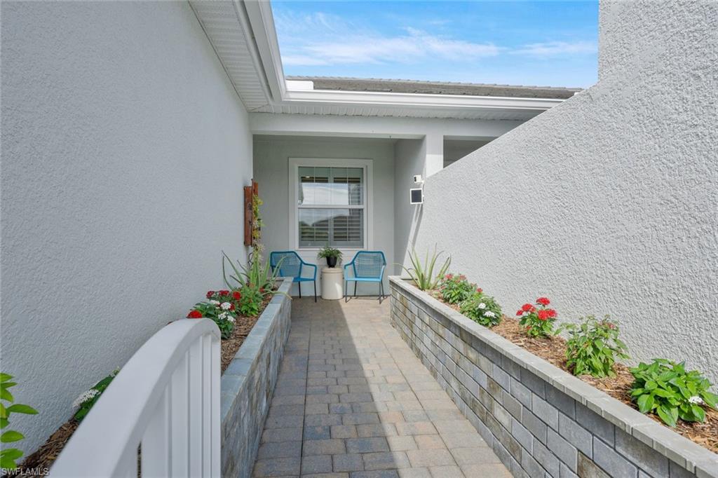 10787 Manatee Key Lane Estero, FL 33928 - Photo 4 of 31 a front view of a house with a chairs