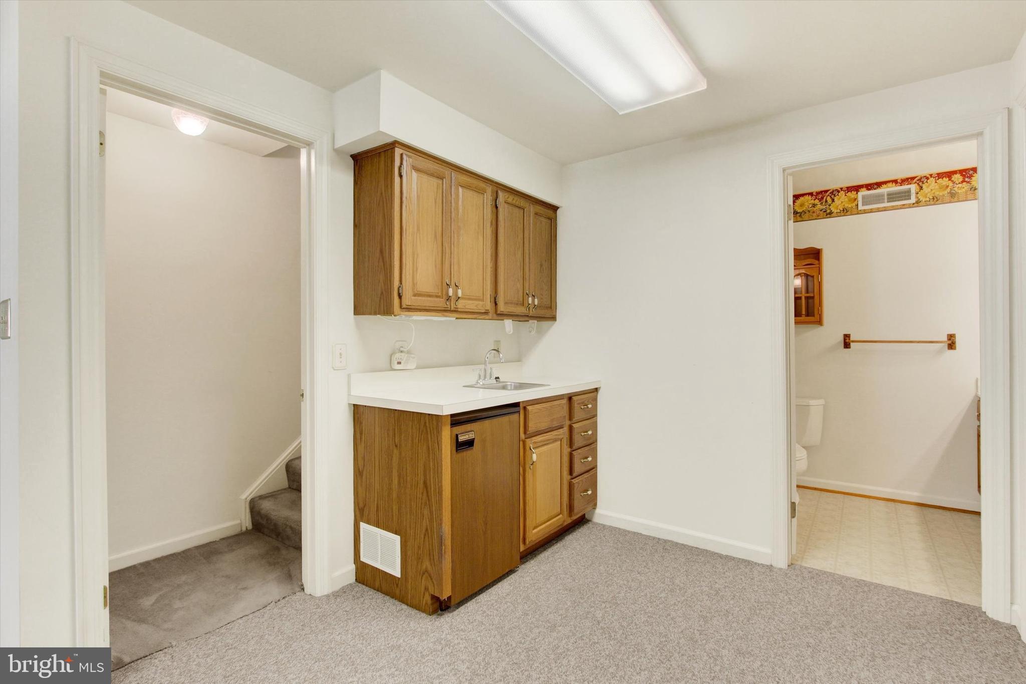 20020 Mt Aetna Road Hagerstown, MD 21742 - Photo 41 of 54 Wet bar with mini-fridge