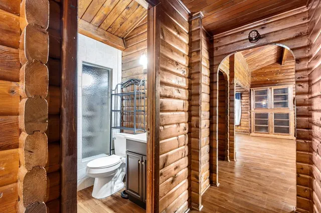 a bathroom with a toilet and shower
