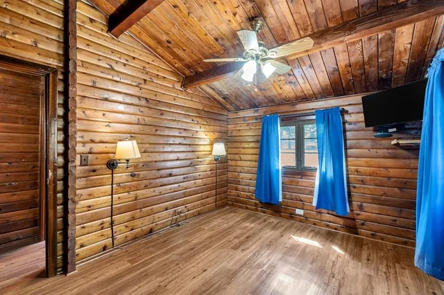 a view of a porch with wooden floor