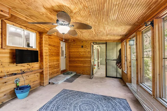 a view of a livingroom with furniture and a flat screen tv