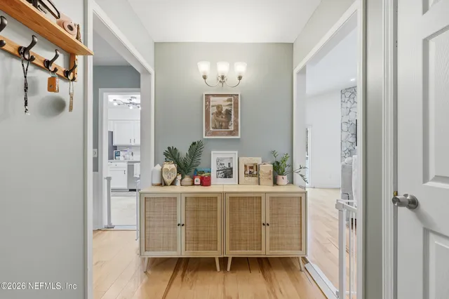 a kitchen with a wooden floor and cabinets