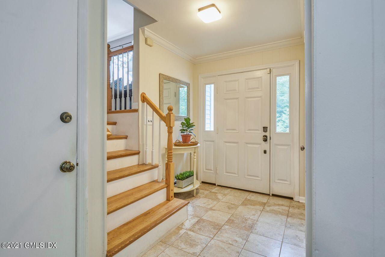 16 Cat Rock Road Cos Cob, CT 06807 - Photo 13 of 26 a view of entryway with white walls and windows