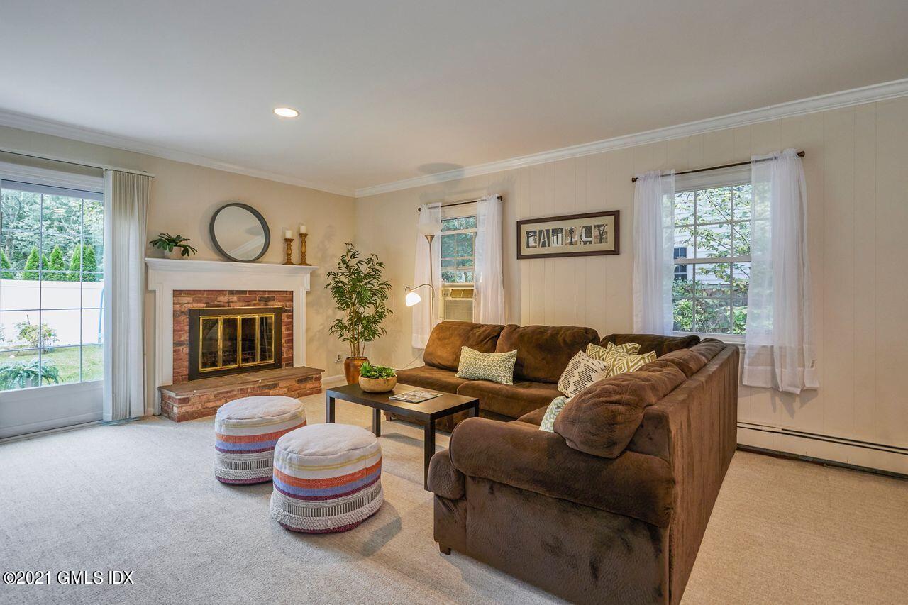 16 Cat Rock Road Cos Cob, CT 06807 - Photo 15 of 26 a living room with furniture and a large window
