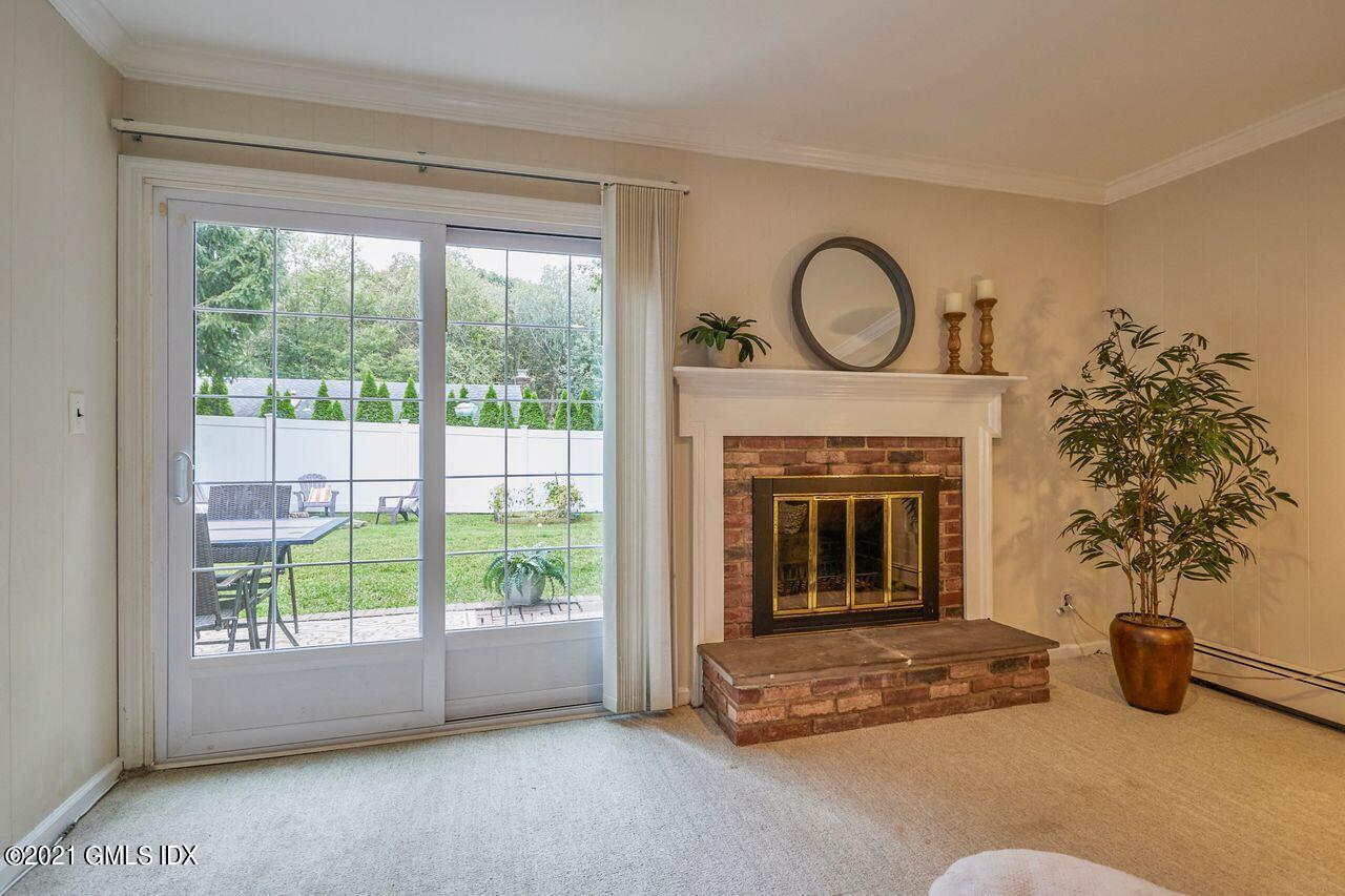 16 Cat Rock Road Cos Cob, CT 06807 - Photo 16 of 26 a living room with furniture and a fireplace