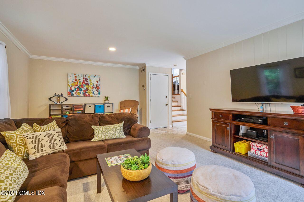 16 Cat Rock Road Cos Cob, CT 06807 - Photo 17 of 26 a living room with furniture and a flat screen tv