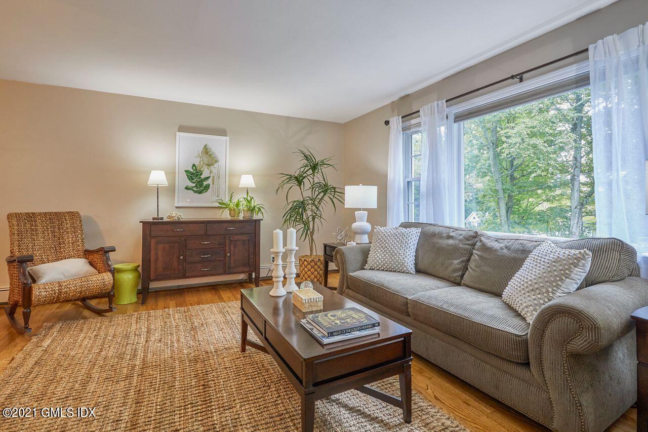16 Cat Rock Road Cos Cob, CT 06807 - Photo 2 of 26 a living room with furniture and a large window