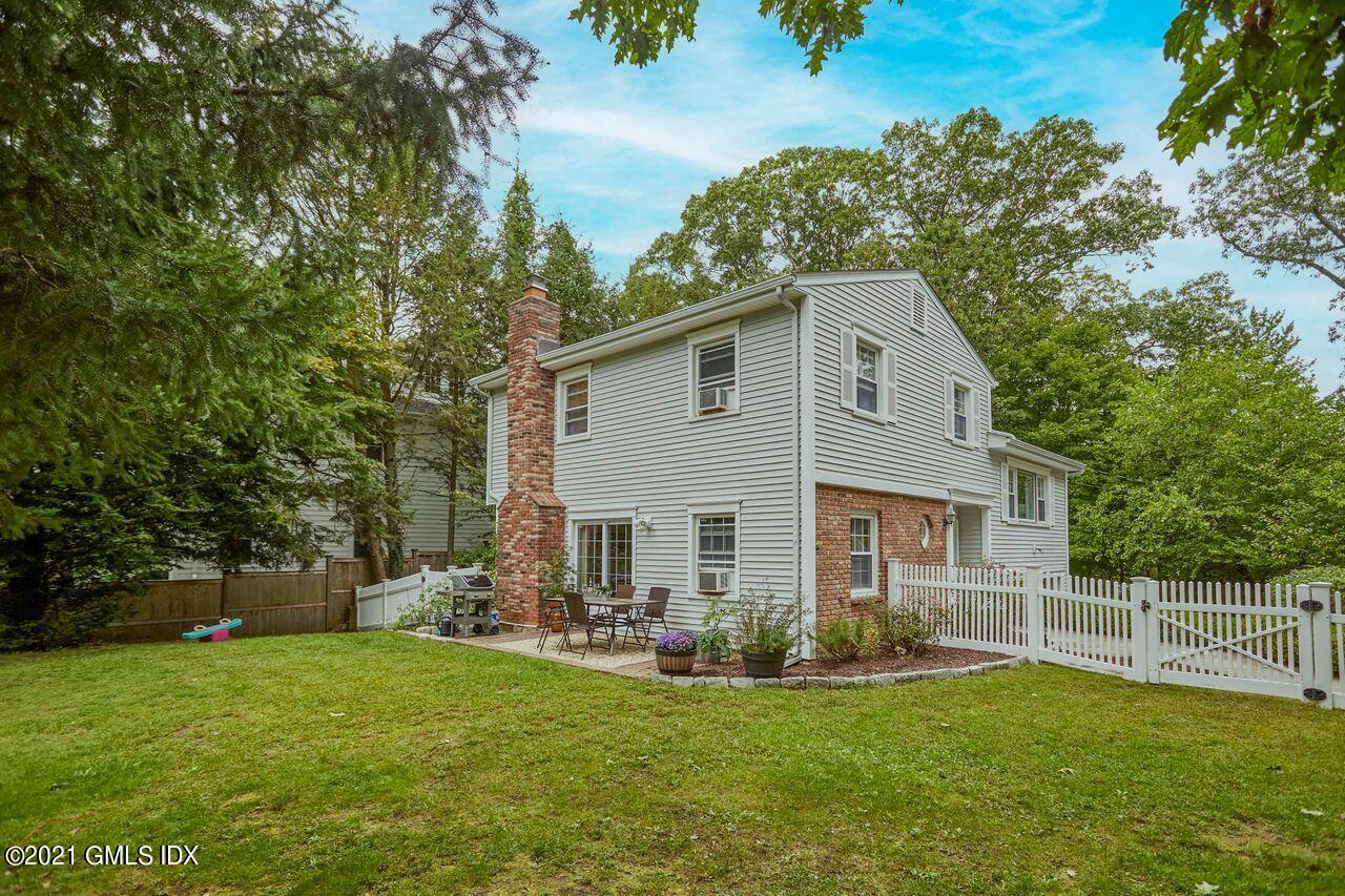 16 Cat Rock Road Cos Cob, CT 06807 - Photo 23 of 26 a front view of house with yard and green space