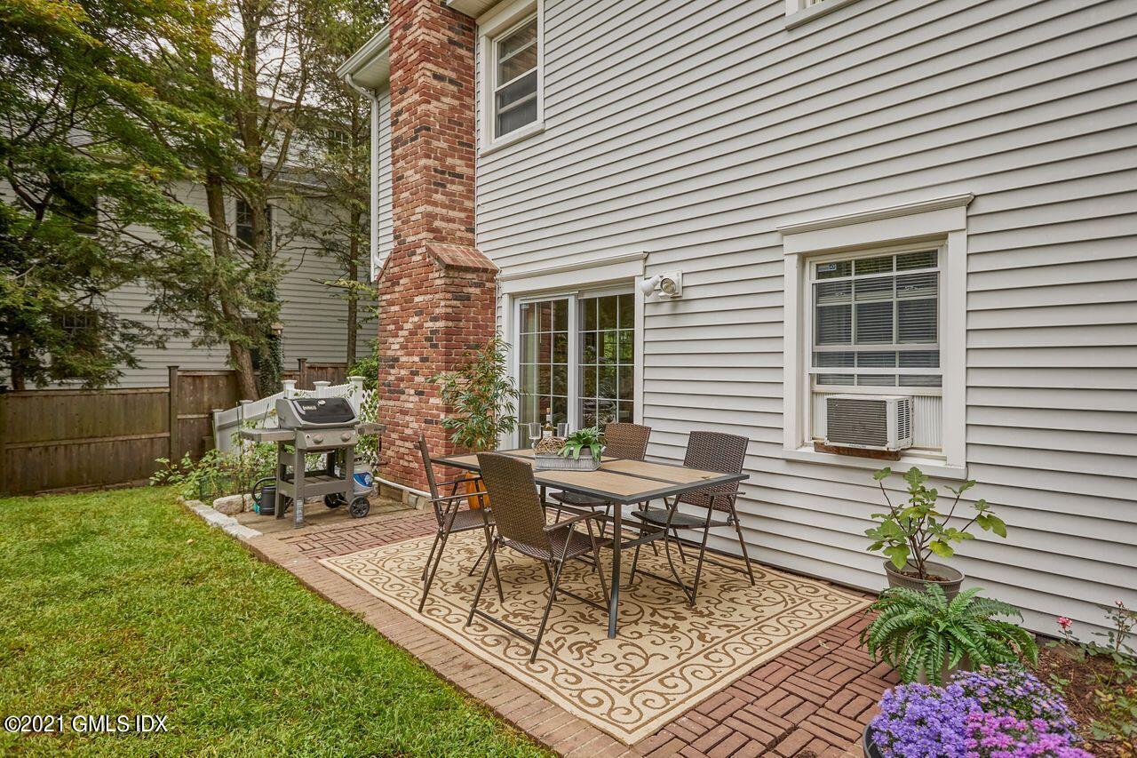 16 Cat Rock Road Cos Cob, CT 06807 - Photo 25 of 26 a view of a outdoor with a chairs and table in a patio