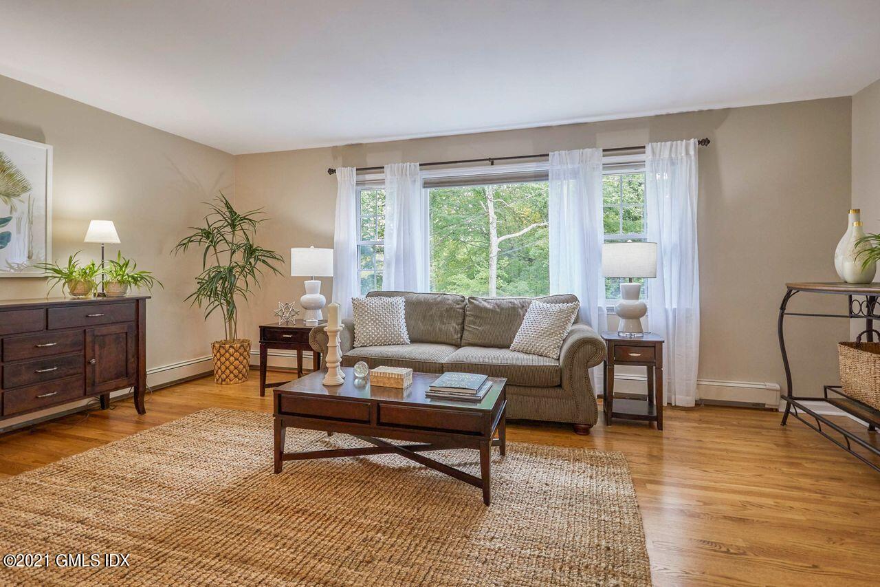 16 Cat Rock Road Cos Cob, CT 06807 - Photo 3 of 26 a living room with furniture and a wooden floor