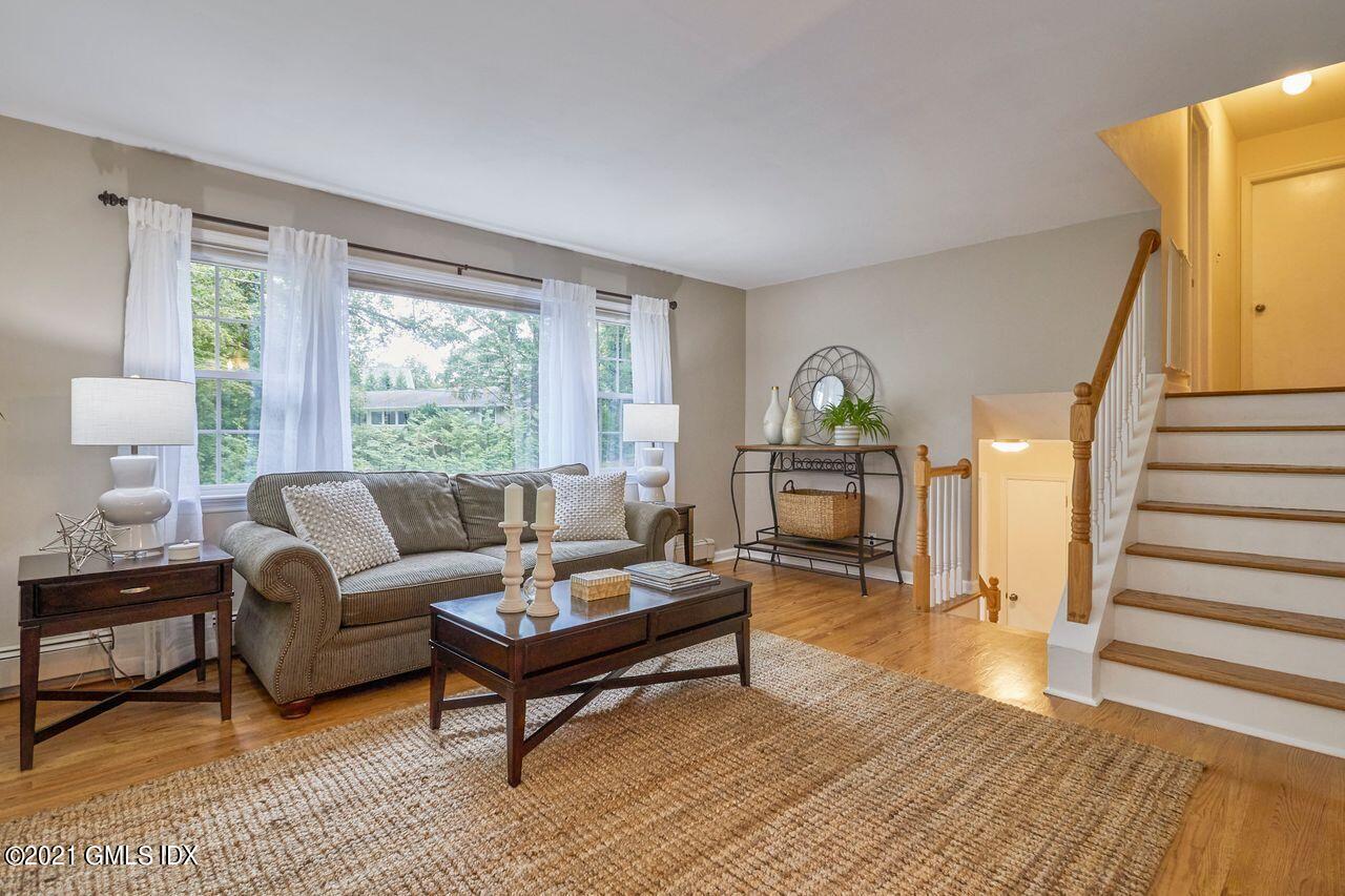 16 Cat Rock Road Cos Cob, CT 06807 - Photo 4 of 26 a living room with furniture and a wooden floor