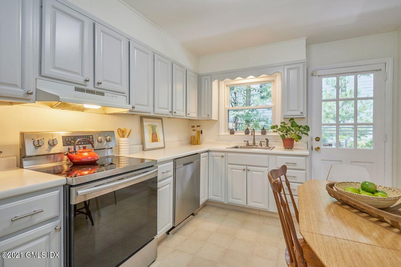 16 Cat Rock Road Cos Cob, CT 06807 - Photo 10 of 26 a kitchen with stainless steel appliances granite countertop a sink stove and cabinets