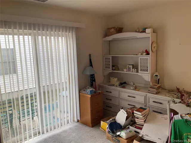 a room with a desk and a window