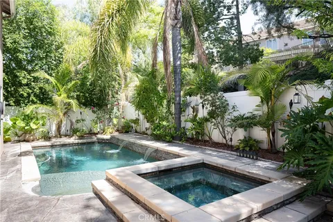 a view of swimming pool with chairs