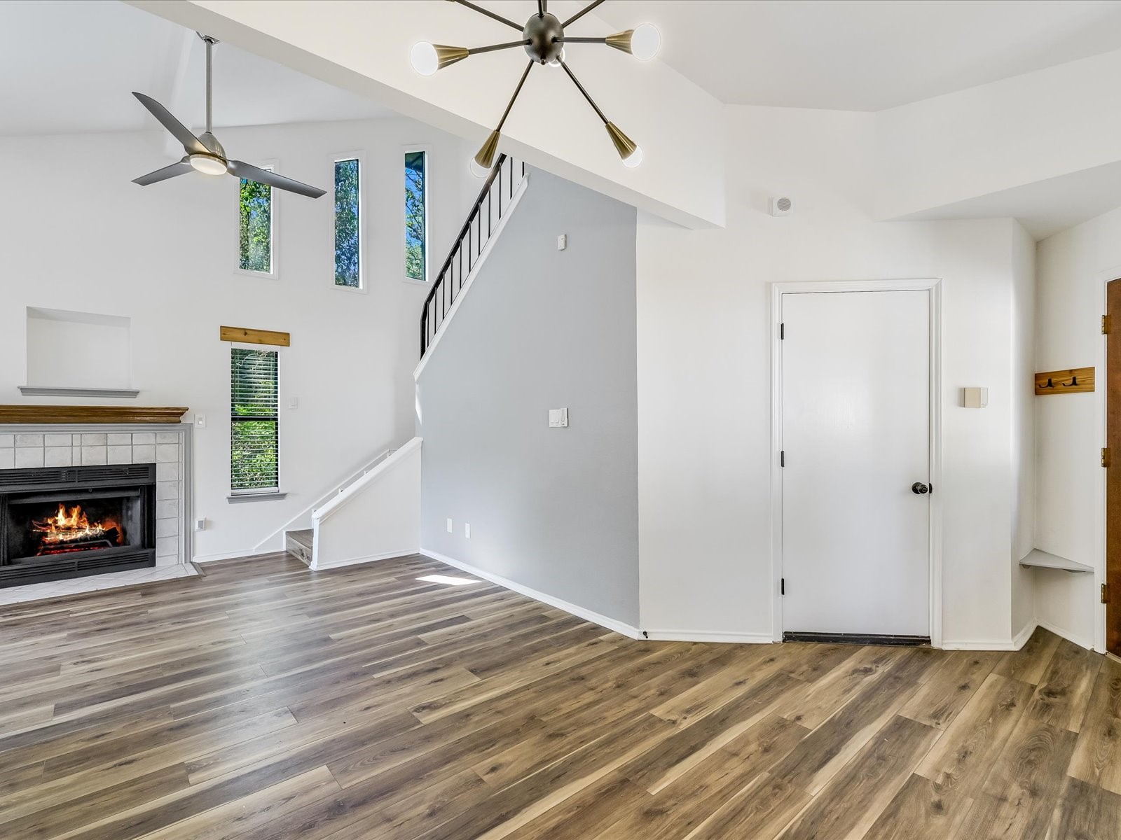 2712 Geronimo Trail Austin, TX 78734 - Photo 10 of 31 a view of empty room with fireplace and wooden floor