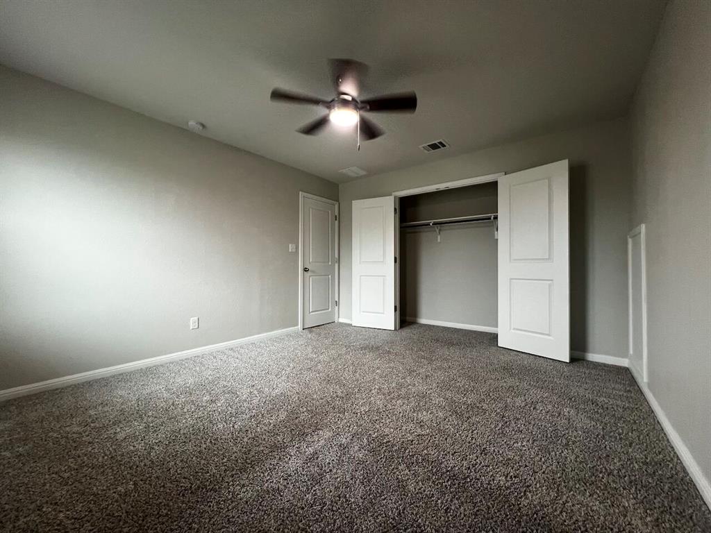 1509 Deering Run Leander, TX 78641 - Photo 36 of 40 Neutral tone wall paint with textured carpet flooring