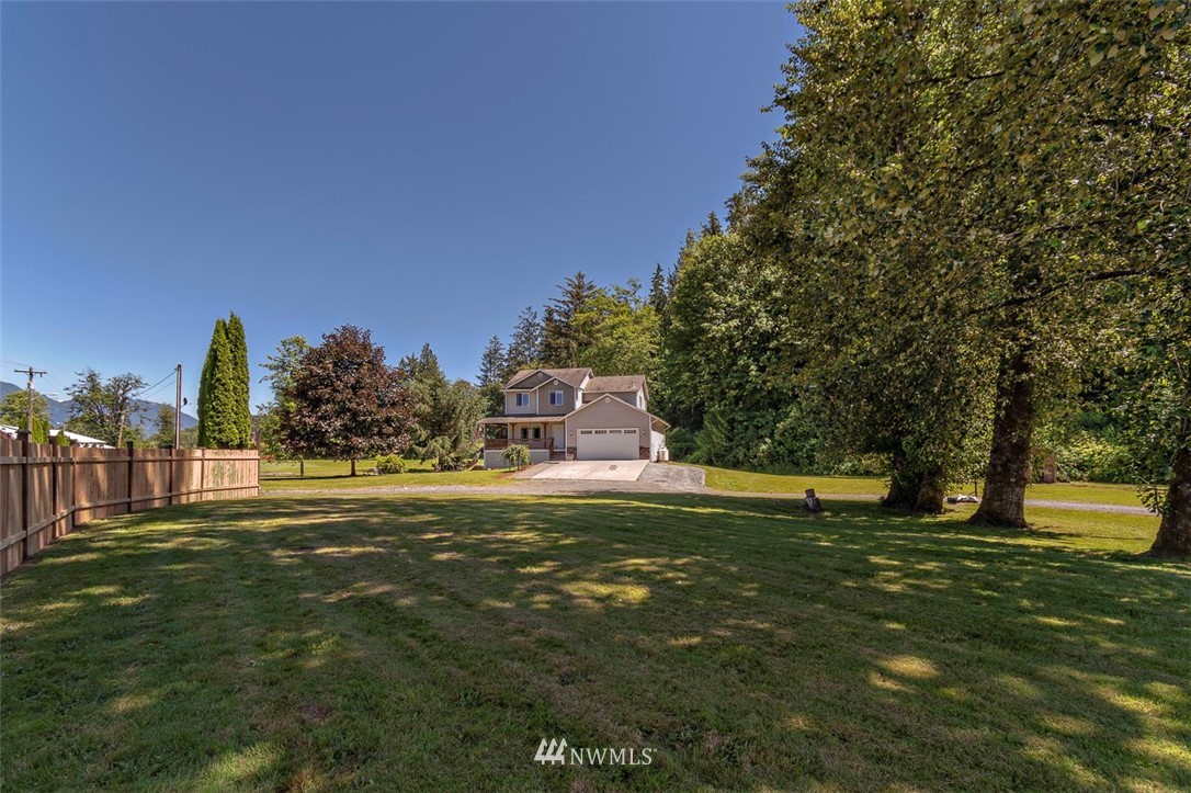 32612 Mann Road Sultan, WA 98294 - Photo 22 of 30 a swimming pool is in the garden of a house