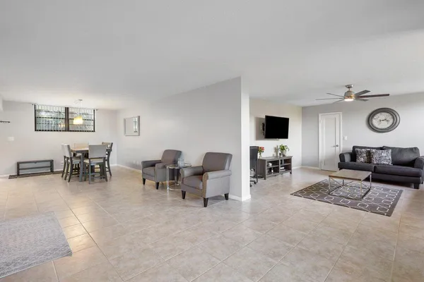 a living room with furniture and flat screen tv
