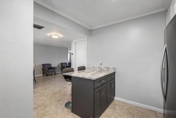 a utility room with sink dryer and washer