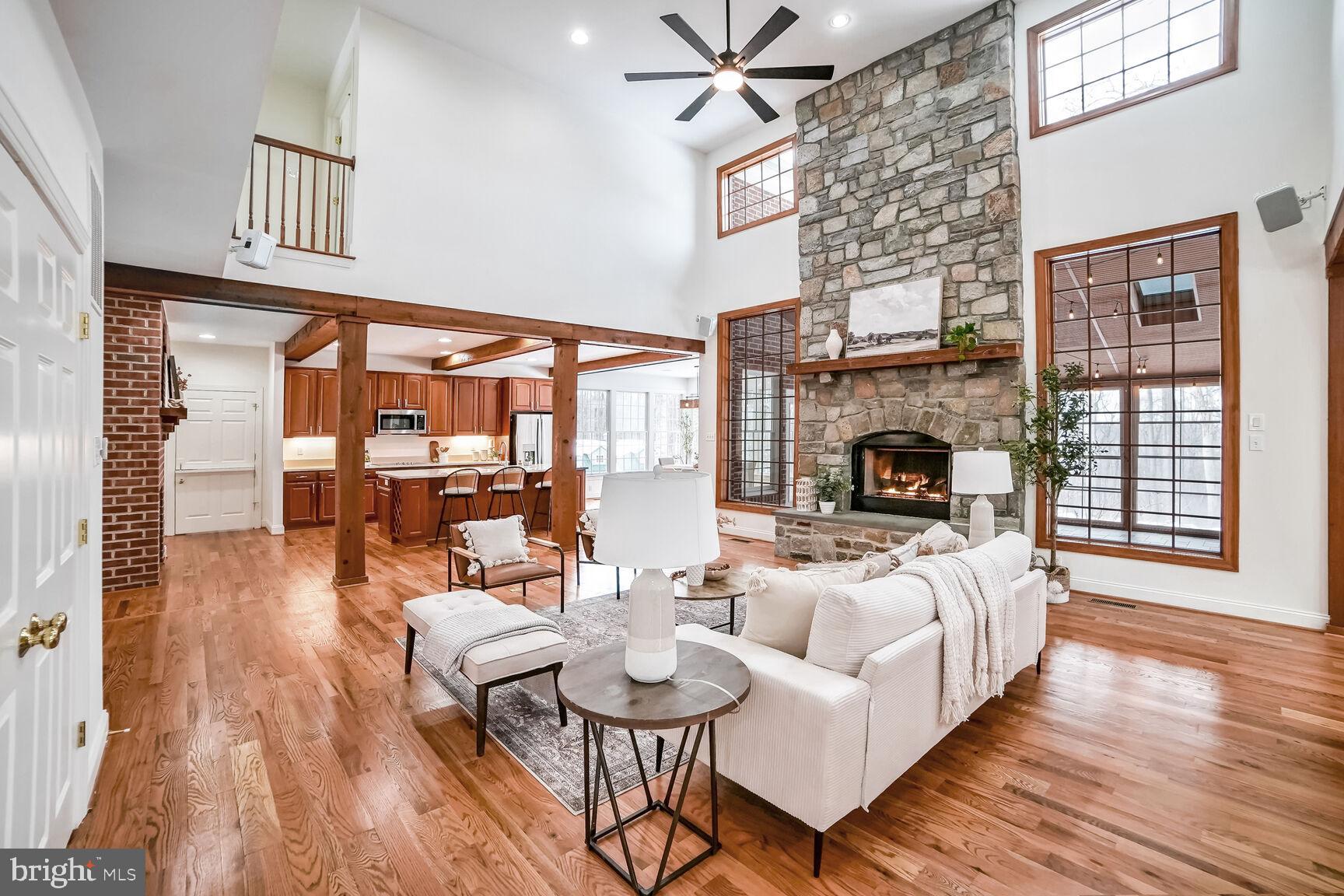 18924 Celebrity Lane Sandy Spring, MD 20860 - Photo 13 of 85 2 story family room with stone gas fireplace