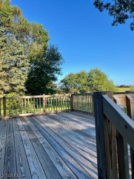61 Gallmeier Road Frenchtown, NJ 08825 - Photo 12 of 15 a view of a deck with wooden floor and fence with a large garden