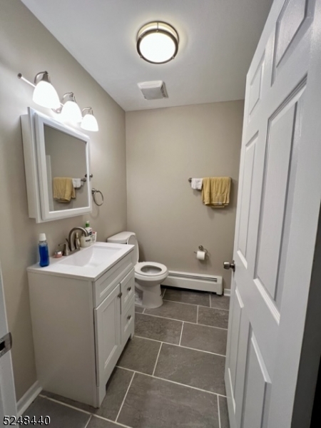 61 Gallmeier Road Frenchtown, NJ 08825 - Photo 6 of 15 a bathroom with a sink a toilet and mirror