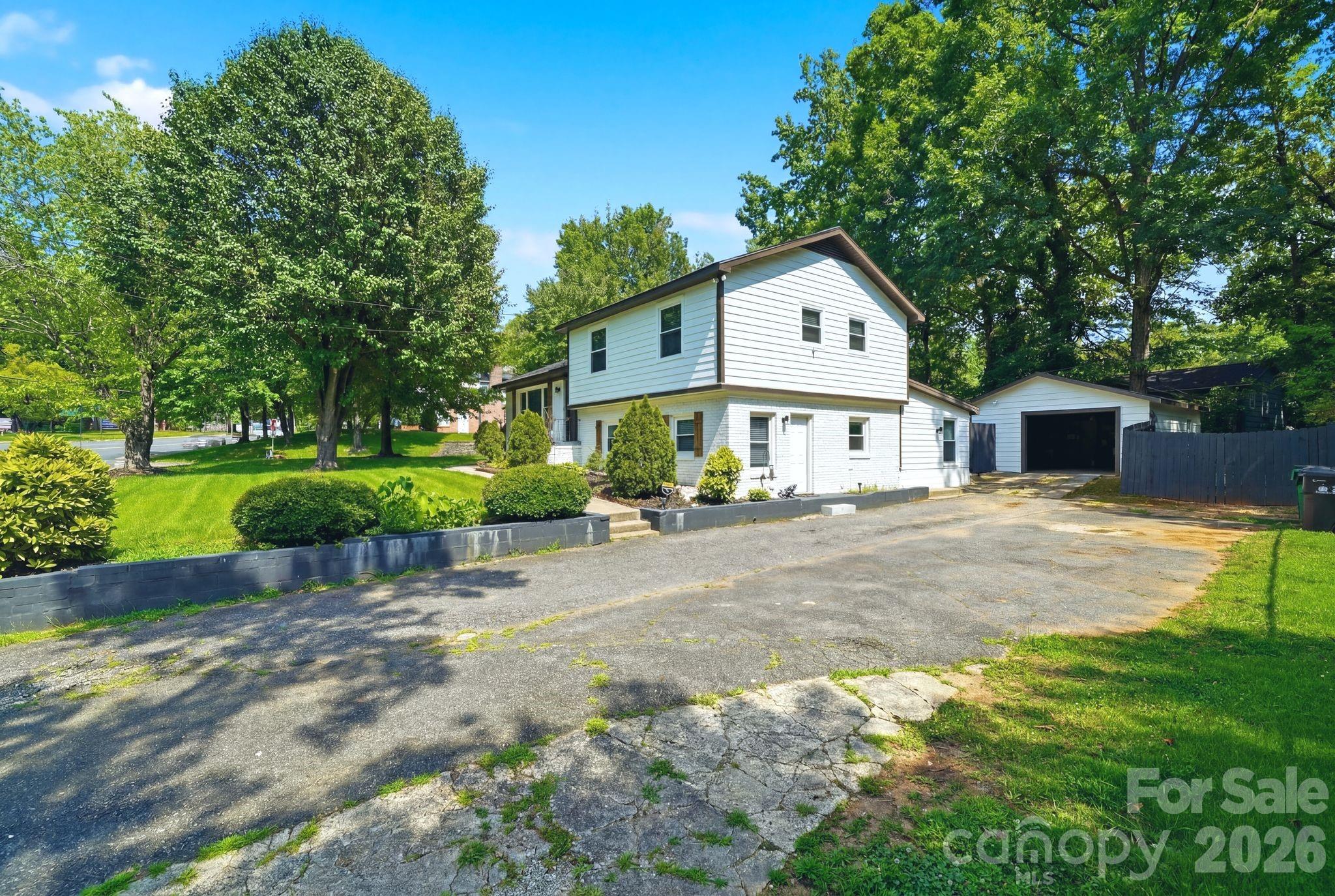 7552 Idlewild Road Charlotte, NC 28212 - Photo 2 of 40 a house view with a outdoor space